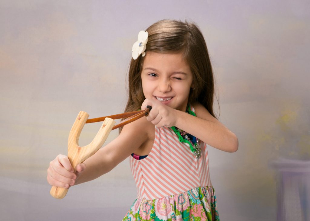 girl with slingshot